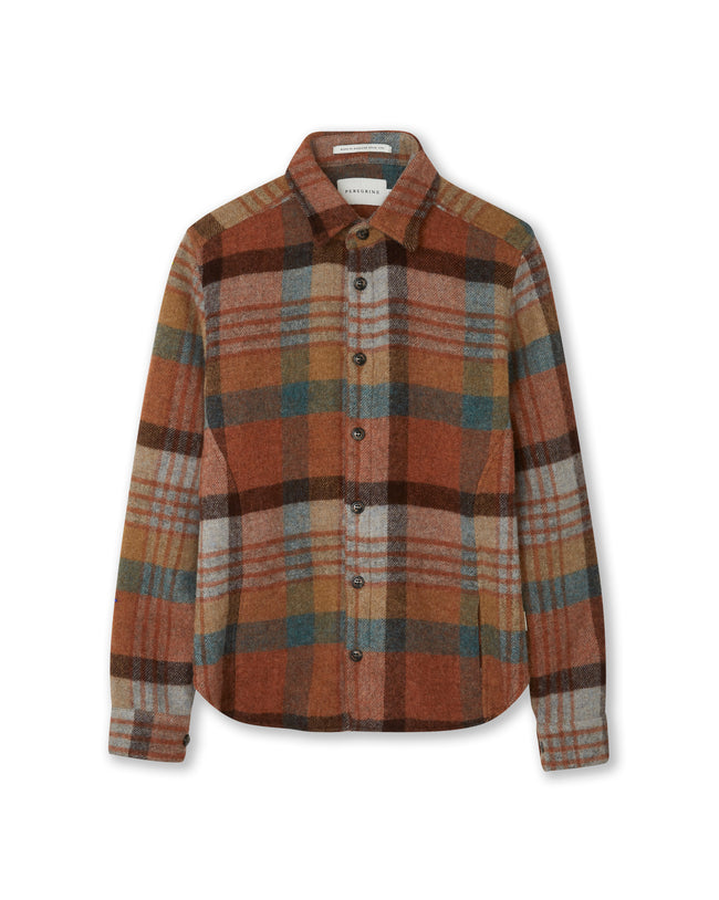 Flatlay image of checked wool shirt with seven buttons down the center front fastening the collared shirt closed, the shirt has a slightly curved hem, the main base colour of the shirt is terracotta with overlaying checked designs consisting of blue, black, light grey and a pale brown.